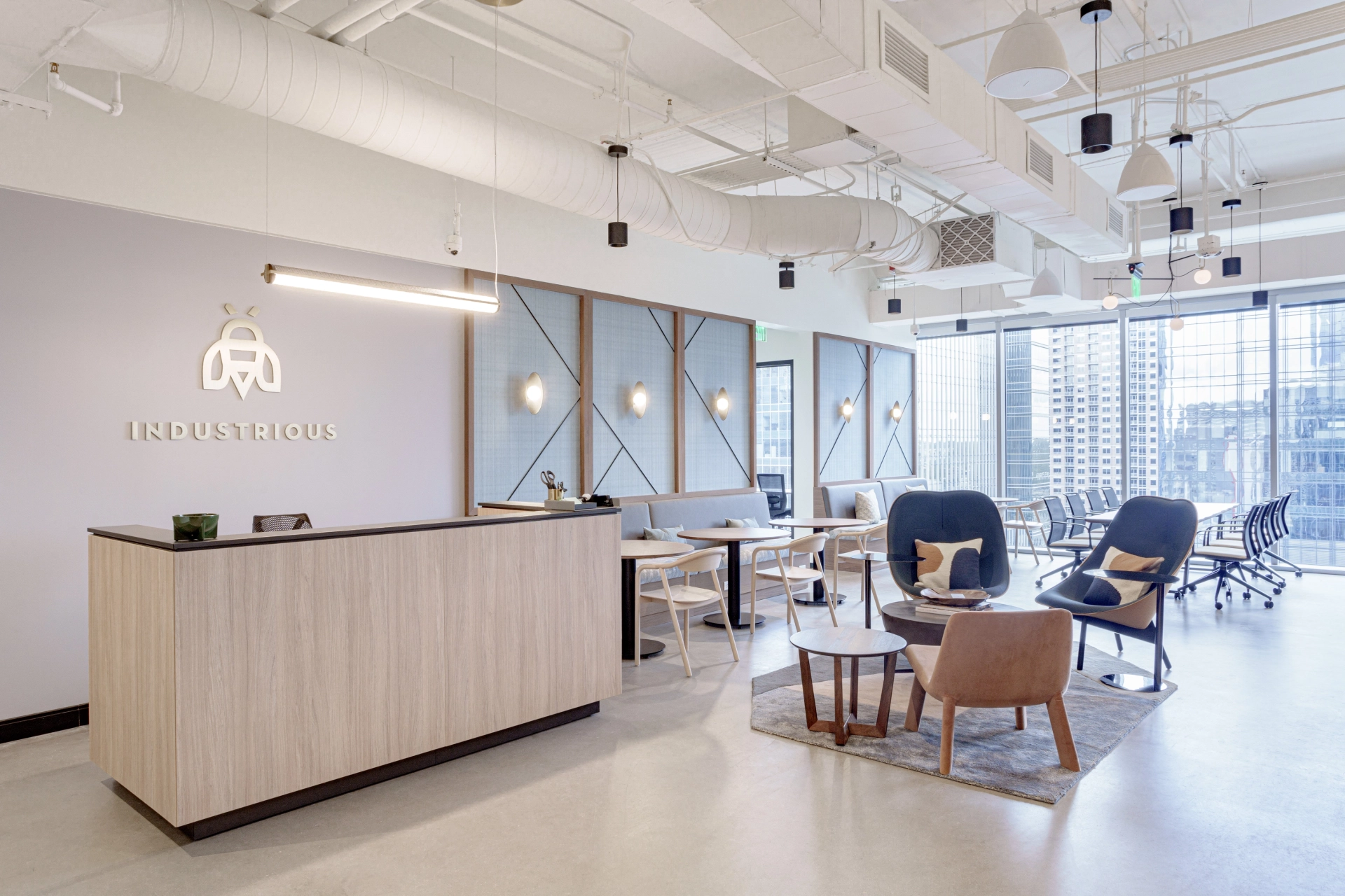 Industrious premium coworking space on 5th Street in downtown Austin with modern reception area and city views